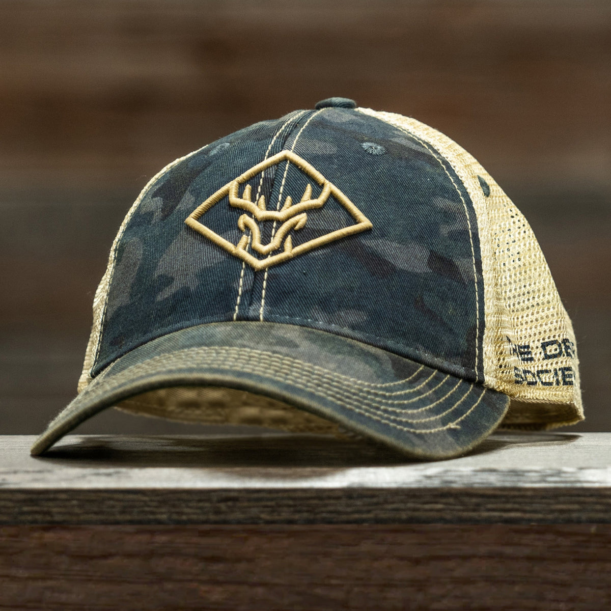 https://thedeersociety.com/cdn/shop/products/1410931BlackcamoHat2.jpg?v=1663783664&width=1200